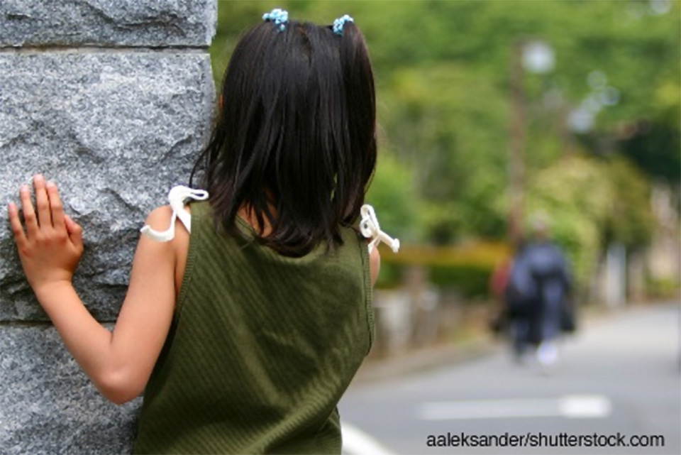 Stock photo of young girl facing away from the camera