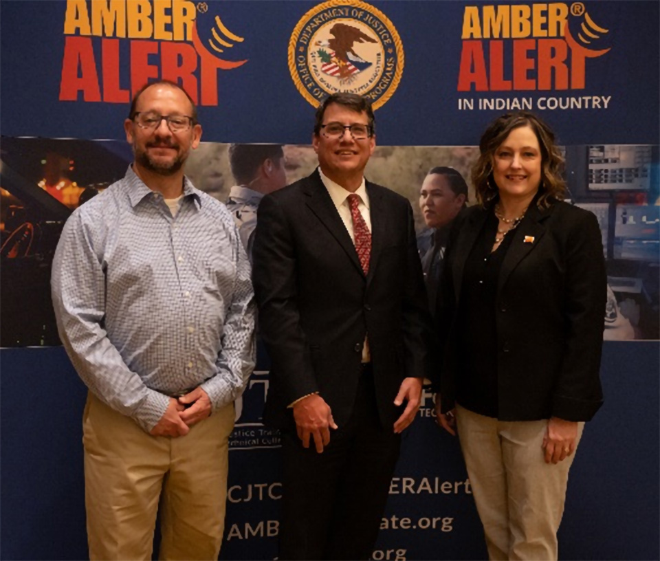 Photo of OJJDP Associate Administrator Jim Antal, Gary Restaino, U.S. Attorney for the District of Arizona, and Janell Rasmussen, Administrator for the AMBER Alert Training and Technical Assistance Program