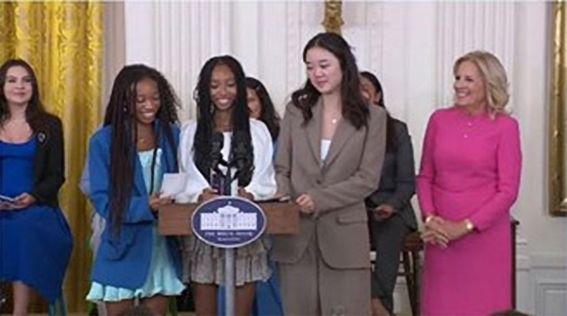 Photo of First Lady Jill Biden and young women being honored at the White House during an event marking International Day of the Girl