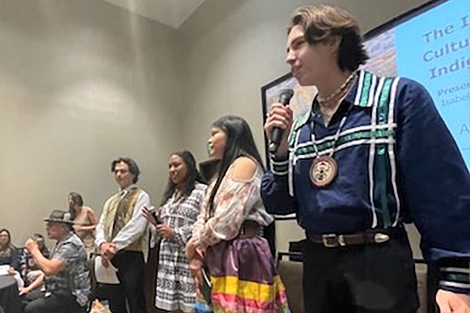 Photo of four Tribal Youth Resource Center Young Leaders during a panel discussion at the OJJDP Tribal Youth Program Midwest Regional gathering