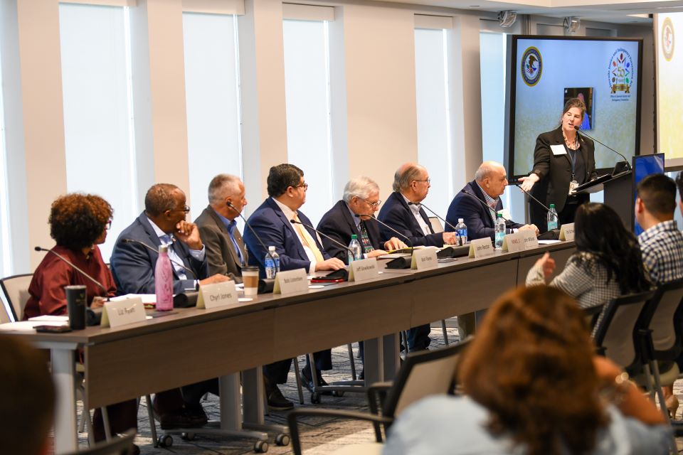 Photo of panel discussion with Administrator Liz Ryan and eight former OJJDP administrators.