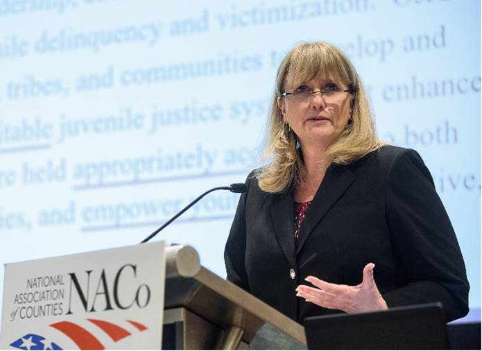 Administrator Caren Harp addresses members of the National Association of Counties' Justice and Public Safety Committee. Photo by Denny Henry.