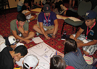 Youth form groups during a Listening to Youth Voices session .