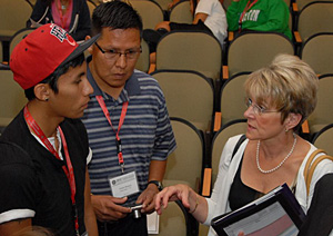 Acting Administrator Melodee Hanes discusses OJJDP's Tribal Youth Program with a youth at the summit.