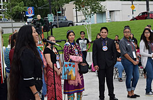 UNITY's Executive Director, Mary Kim Titla (left), speaks at the ceremonial lighting of the UNITY Fire at the beginning of the 2014 National UNITY Conference.