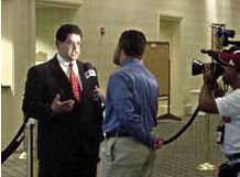 OJJDP Administrator J. Robert Flores conducts an interview in Spanish with a reporter covering the Youth Gang Symposium for Univision, a Spanish-language television network.