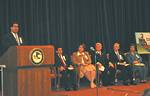 OJJDP Administrator J. Robert Flores welcomes participants to the U.S. Department of Justice's 22nd annual commemoration of National Missing Children's Day, held May 20, 2005, at the Department's Hall of Justice in Washington, DC. Seated are Attorney General Alberto R. Gonzales; Acting Assistant Attorney General for the Office of Justice Programs, Tracy A. Henke; Robbie Callaway, Founding Board Member, National Center for Missing and Exploited Children (NCMEC); Ernie Allen, NCMEC President; and guest speaker Gay Smither. 