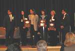 A team of four North Carolina officers from the U.S. Postal Service, State Bureau of Investigation, and Hickory Police Department conducted an investigation of a child prostitution and pornography ring that led to the arrests of the ring's leader and two other participants. The officers received a National Exploited Children's Law Enforcement Award.