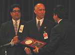 Lieutenant Kenny Wynns of the Midwest City (OK) Police Department accepts a National Exploited Children's Law Enforcement Award from Attorney General Gonzales for dismantling a child prostitution ring. Over the course of 26 months, Lieutenant Wynns identified more than 100 individuals who were engaged in prostituting children. 