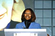 Assistant Attorney General Regina Schofield speaking at opening ceremony.