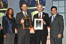 Assistant Attorney General Schofield and Attorney General Gonzales present plaques to Steve Largent and Ernie Allen at AMBER Alert Awareness Day ceremony.