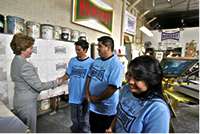 Photo of Laura Bush meeting members of the Homeboy Industries program.