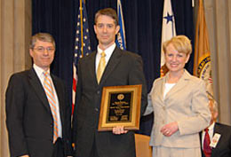 The Law Enforcement Award: (l. to r.) Deputy Attorney General Ogden; Special Agent Greg Ryman (FBI); Acting Assistant Attorney General Robinson.