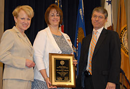 The Missing Children Citizen of the Year Protection Award: (l. to r.) Acting Assistant Attorney General Robinson, Julie Mosbacher, Deputy Attorney General Ogden.