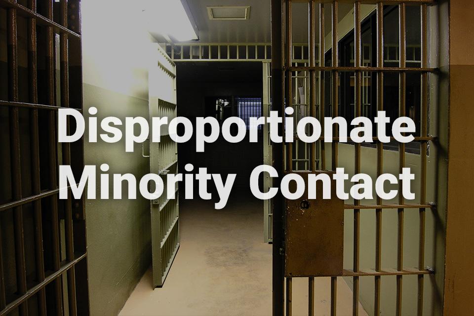 Disproportionate Minority Contact text written over background image of detention facility