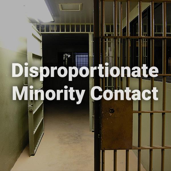 Disproportionate Minority Contact text written over background image of detention facility