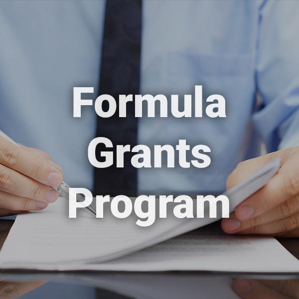 Formula Grants Program text written over a background image of male professional