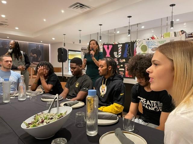 Cheyenne Tyler, Executive Director, Café Momentum Pittsburgh speaks to guests at the family meal