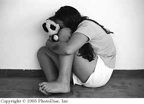 Girl hugging a teddy bear