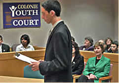 First Lady Laura Bush listens to the opening statement at youth court in Colonie, NY. 