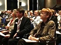 U.K. Solicitor General Vera Baird listens to the launch proceedings.
