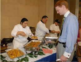 Sampling Hispanic treats at the celebration.