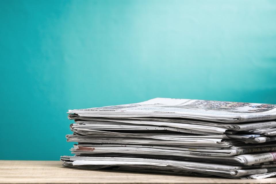 Stack of newspapers on a table