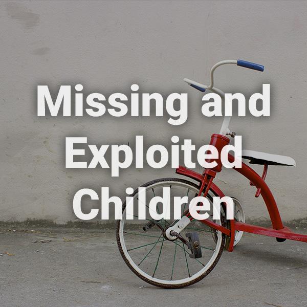 Missing and Exploited Children text written over a background image of an empty tricycle