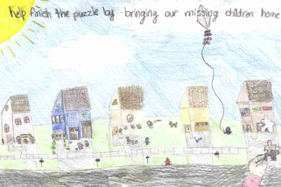 Poster of a puzzle of houses along a street featuring "help finish the puzzle by bringing our missing children home"